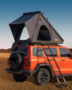 Naturnest Orion Mini Hard Shell Rooftop Tent mounted on SUV