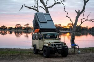 Naturnest Sirius 3 Clamshell Rooftop Tent mounted on SUV