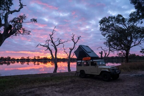 Naturnest Sirius 3 Clamshell Rooftop Tent mounted on SUV