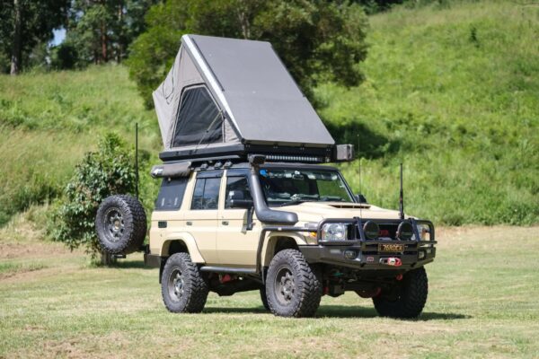 Naturnest Sirius 3 Clamshell Rooftop Tent mounted on SUV
