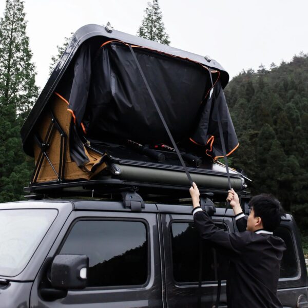 Naturnest Sirius 2 Clamshell Rooftop Tent mounted on SUV
